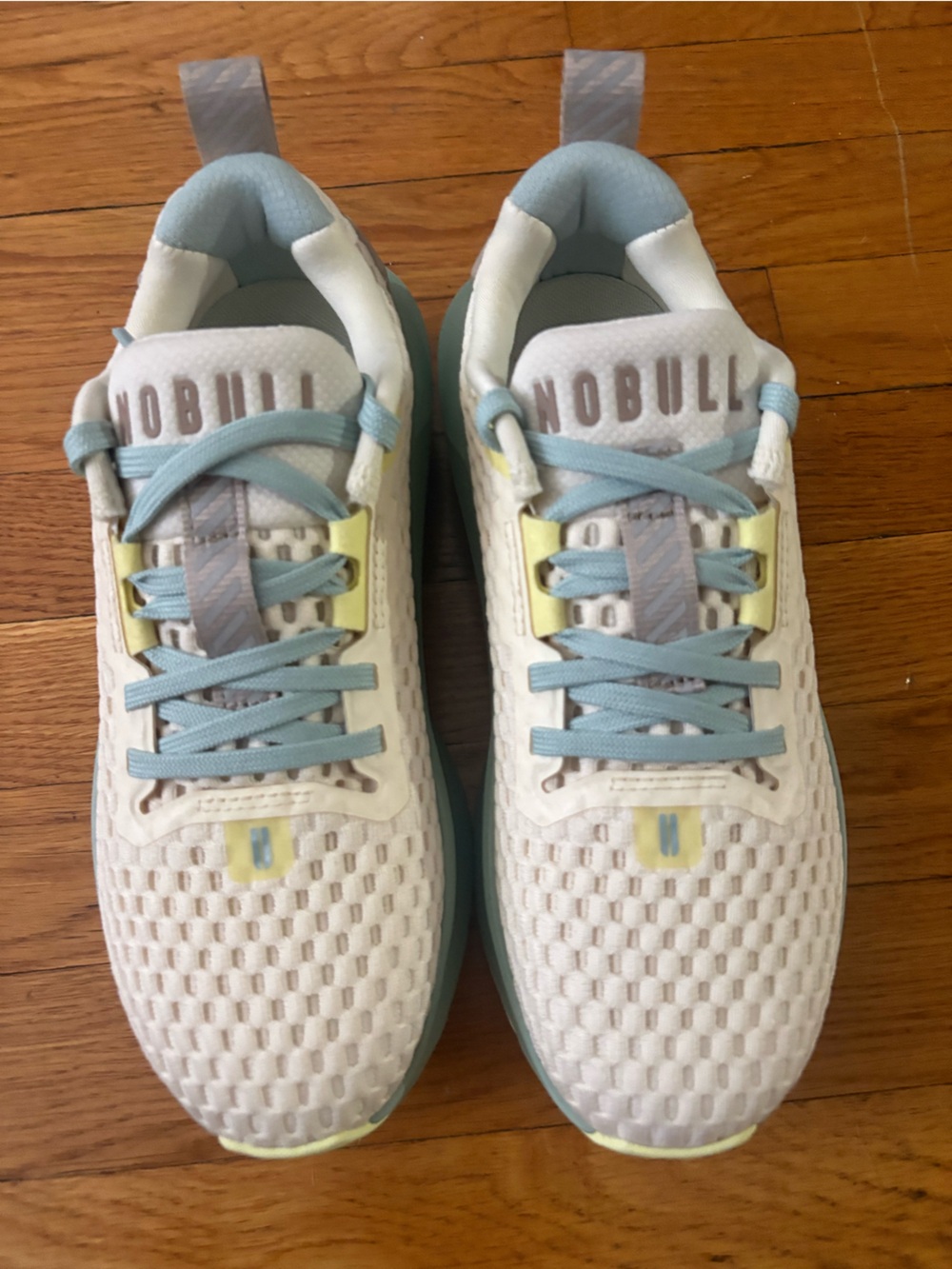 NOBULL White and Light Blue Sneakers with Yellow Accents